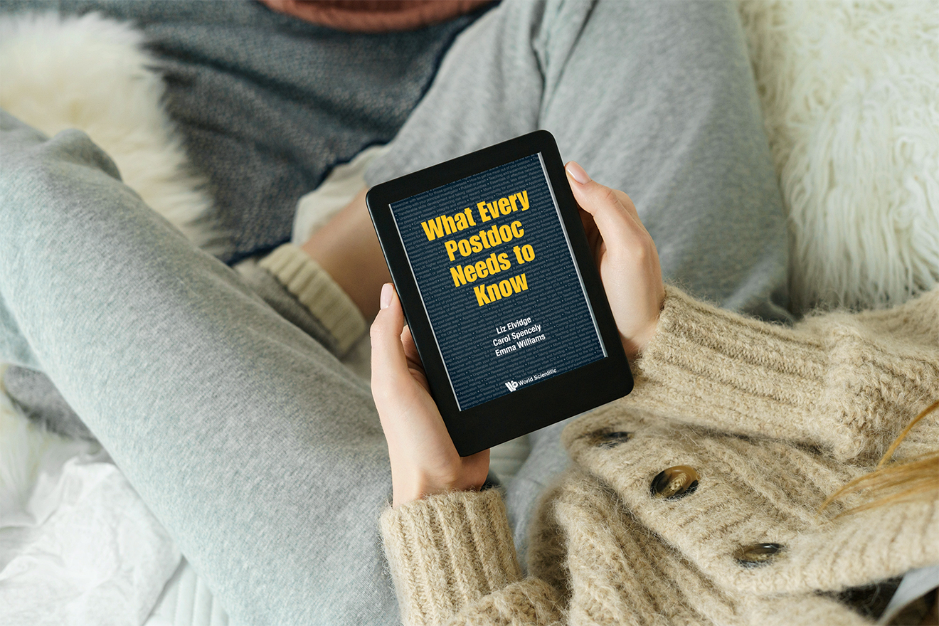 A woman holds an e-reader with What every postdoc needs to know on it