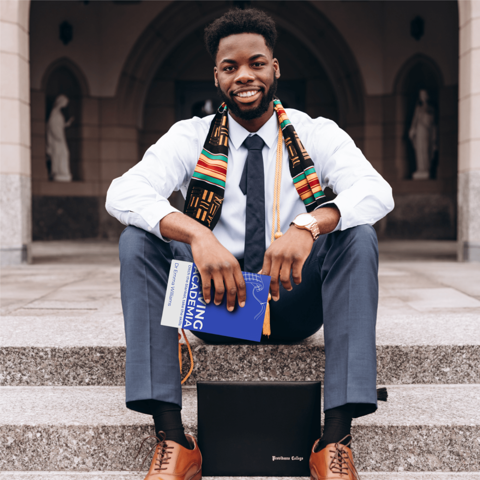 A man sitting on college steps holding Leaving Academia